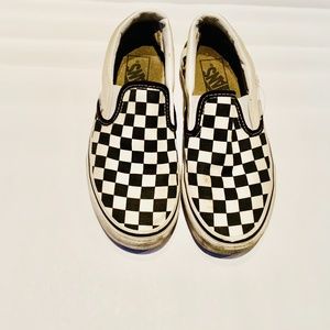 Black and white checkered slip on vans